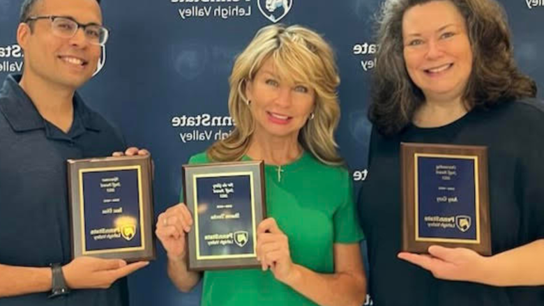 A photo of three Penn State Lehigh Valley faculty members; Amy Gery, 莎伦·特尔查和伊扎克·迪亚兹因他们的成就在全校日获得表彰.